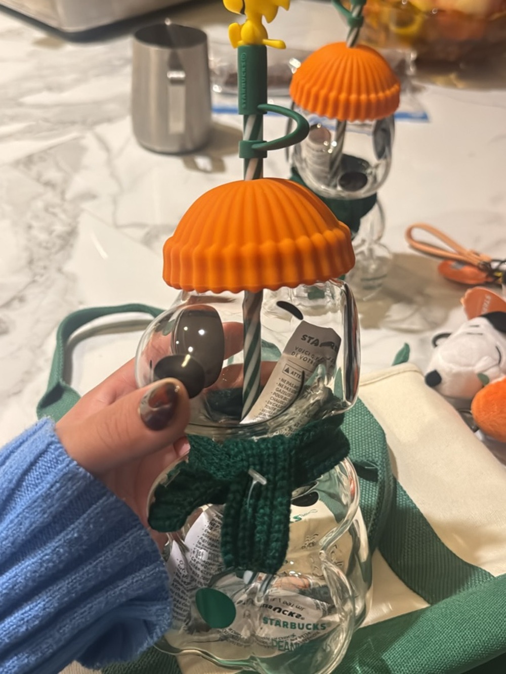 Starbucks/Peanuts Orange-Top Glass Bottle with Green Knit Sleeve and Straw